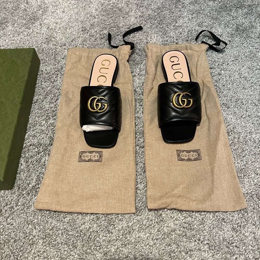 Gucci Black Slides with Gold Emblem